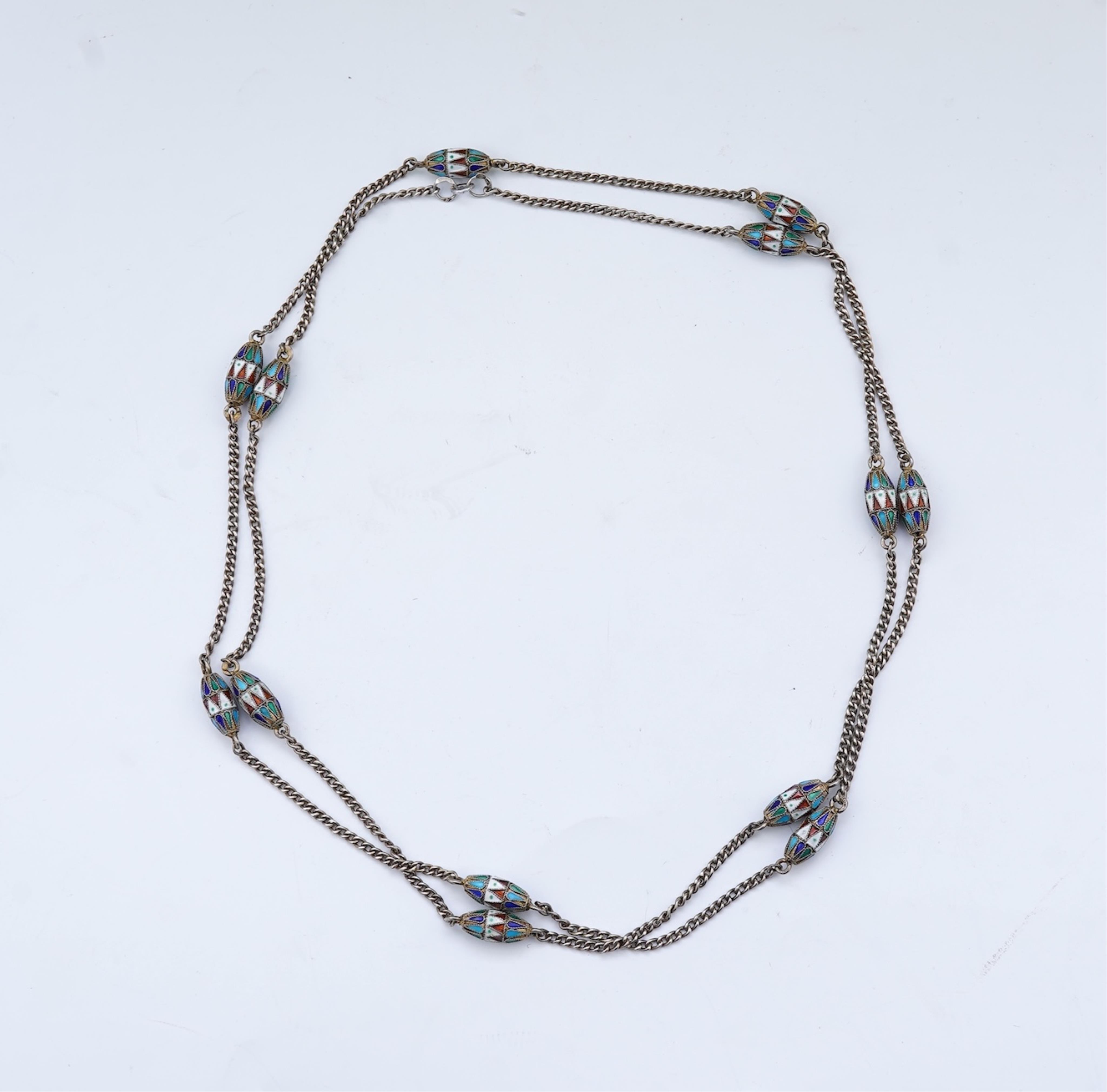 A silver and enamel long chain necklace, Russia, early 20th century